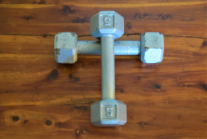 Dumbell weights in the form of a cross representative of spiritual exercise for Christ and our soul