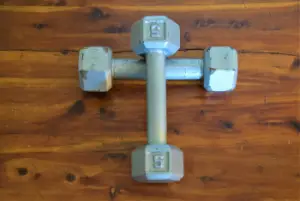 Dumbell weights in the form of a cross representative of spiritual exercise for Christ and our soul